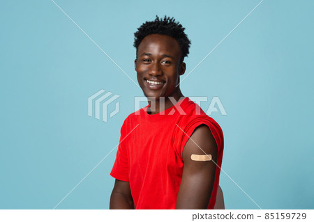 Healthcare Concept. Smiling African Guy Showing Arm With Plaster After Coronavirus Vaccination 85159729
