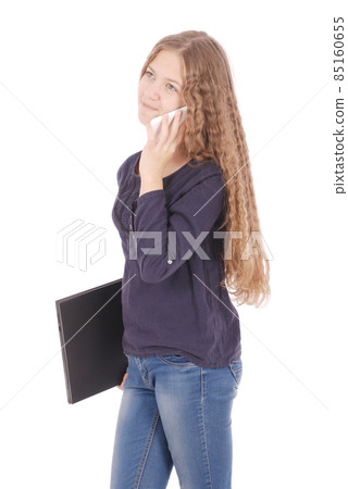 Girl lying sideways on the floor with laptop and smartphone 85160655