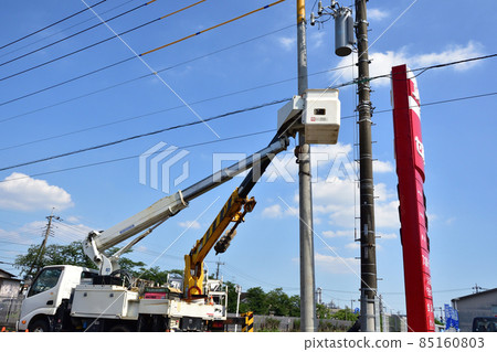 Telephone pole replacement work performed using a hole-drilling pole construction vehicle and an aerial work vehicle Telephone pole replacement work performed using a hole-drilling pole construction vehicle and an aerial work vehicle 85160803