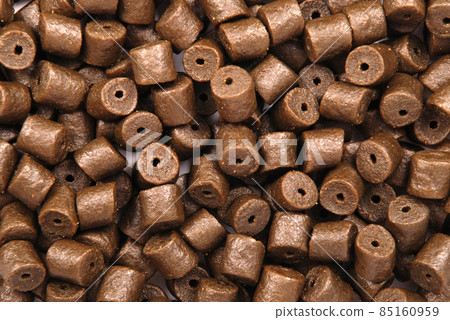 Brown pre-drilled halibut pellets 85160959