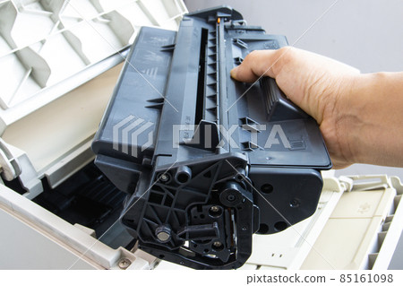 Technicians replacing toner in laser printer concept office supplies repair Technicians replacing toner in laser printer concept office supplies repair 85161098
