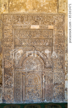 Ornate engraved stone wall with floral patterns and calligraphy, Ibn Tulun Mosque, Cairo, Egypt 85161471