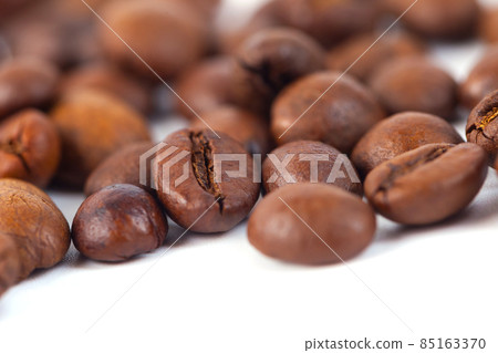 Roasted coffee beans isolated on white background. Three coffee beans Roasted coffee beans isolated on white background. Three coffee beans 85163370