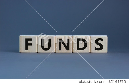 Funds symbol. Concept word 'funds' on wooden cubes on a beautiful grey table. Grey background. Business and funds concept. Funds symbol. Concept word 'funds' on wooden cubes on a beautiful grey table. Grey background. Business and funds concept. 85165713