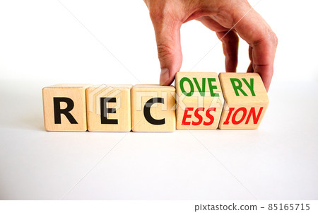 Recovery and recession symbol. Businessman turns cubes and changes the word 'recession' to 'recovery'. Beautiful white table, white background. Business and recovery - recession concept. Copy space. 85165715