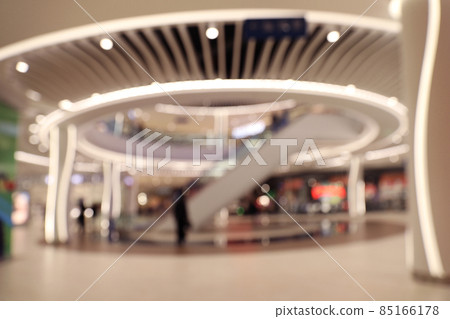 Blurred view of modern shopping mall interior. Bokeh effect 85166178