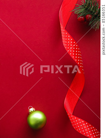 Christmas flatlay and holiday design concept. Decoration, ornament and xmas gift wrapping on red paper background as flat lay top view 85166351