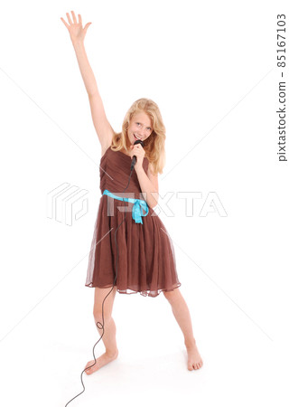 Happy young beautiful girl singing with microphone Happy young beautiful girl singing with microphone 85167103