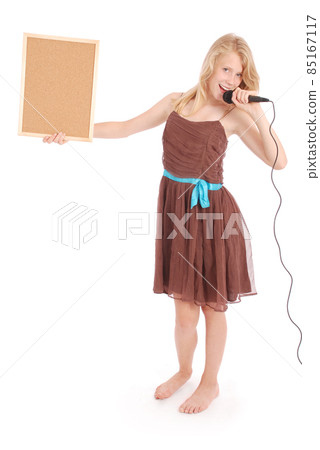 Happy young beautiful girl singing with microphone 85167117