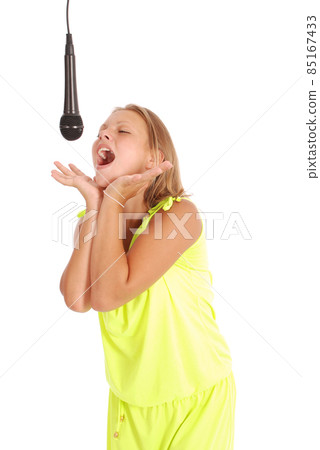 Happy young beautiful girl singing with microphone 85167433