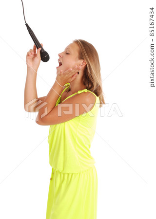 Happy young beautiful girl singing with microphone Happy young beautiful girl singing with microphone 85167434