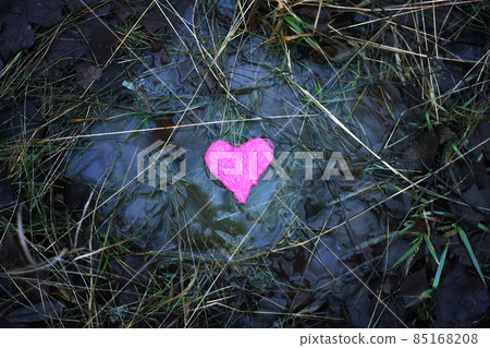 Small colorful heart in a puddle Small colorful heart in a puddle 85168208