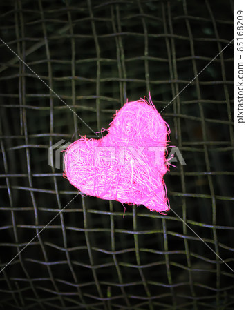 Colorful decorative heart on old rustic iron sieve background. conceptual photo. 85168209