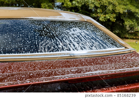 Cleaning the car with foam car wash in self service Cleaning the car with foam car wash in self service 85168239