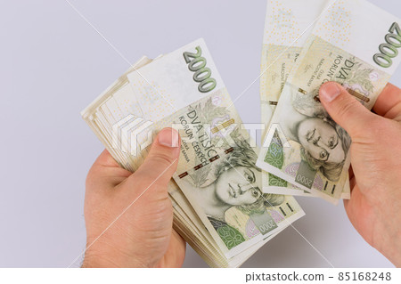 Czech koruna CZK banknote is counting in hand 85168248