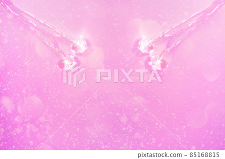 Two small glass hearts on soft pink background. Valentine's day symbol. Decorative element. Two small glass hearts on soft pink background. Valentine's day symbol. Decorative element. 85168815
