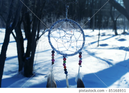 Dream catcher on winter nature background. Dream catcher on winter nature background. 85168931