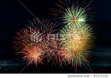 Colorful fireworks on a black background. Celebration and holidays concept. Independence Day 4th of July, New Year, festival. Bright explosions of lights in sky. Place for your text. 85171105