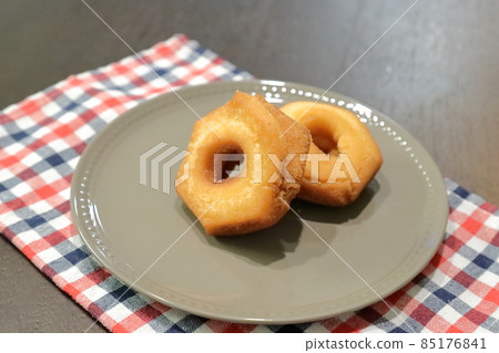 Two donuts on a plate of Greige Two donuts on a plate of Greige 85176841