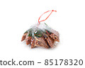 fried nuts in plastic bag package isolated 85178320