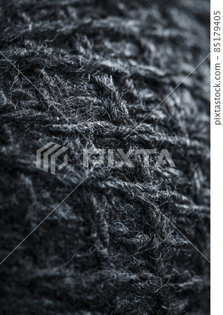 Gray threads of natural wool close-up in full screen. Gray threads of natural wool close-up in full screen. 85179405