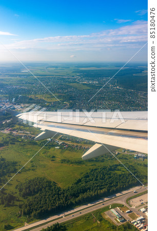 View from the airplane window during taking off on a clear summer morning. Yekaterinburg, Russia View from the airplane window during taking off on a clear summer morning. Yekaterinburg, Russia 85180476