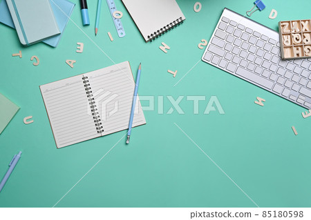Top view empty notebook and various stationery on blue background. Back to school concept. 85180598