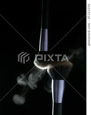 Makeup brushes' touch on black background Makeup brushes' touch on black background 85181056