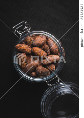 Dried cocoa beans. Cacao beans in jar. 85183581