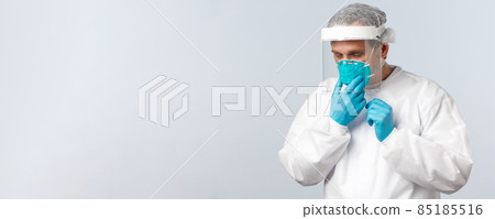 Covid-19, preventing virus, healthcare workers and vaccination concept. Tired doctor working in clinic with contaigned patients, sick coronavirus, fixing medical respirator while wearing PPE Covid-19, preventing virus, healthcare workers and vaccination concept. Tired doctor working in clinic with contaigned patients, sick coronavirus, fixing medical respirator while wearing PPE 85185516
