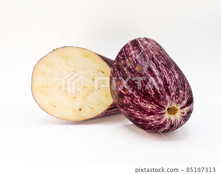 piece of cut veined eggplant isolated on light background piece of cut veined eggplant isolated on light background 85187313