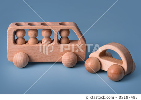 Wooden cars, baby toy for child on blue background. Eco friendly, plastic free toddler kids toys. Educational Montessori learning wooden toys. 85187485