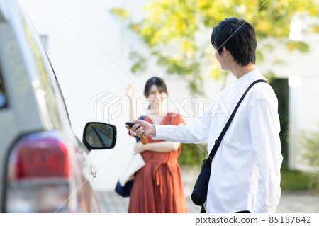 Young men and women going for a drive 85187642