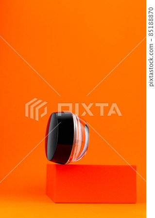 Cosmetic face cream tonal foundation glass jar mockup geometrical podium orange background. Balancing BB makeup product. Cosmetic face cream tonal foundation glass jar mockup geometrical podium orange background. Balancing BB makeup product. 85188870