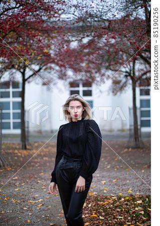 White young european woman with building behind 85190256