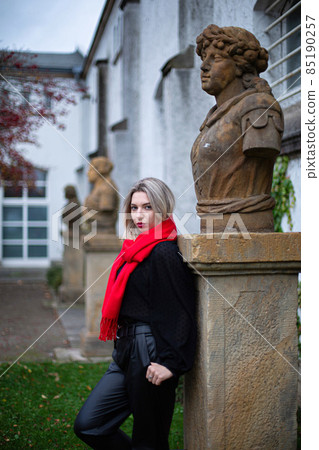 Woman in red scarf in autumn 85190257