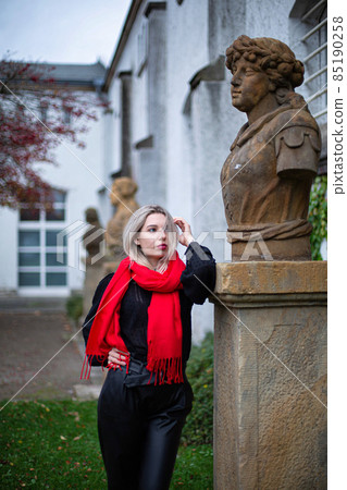 Woman in red scarf in autumn 85190258