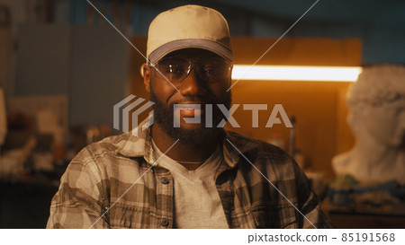 Friendly black artisan in workshop Friendly black artisan in workshop 85191568