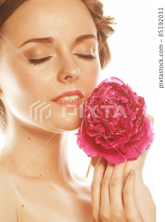 young beauty woman with flower peony pink closeup makeup soft tender gentle look 85192031