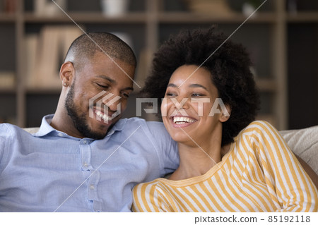 Happy African American couple relaxing at home 85192118