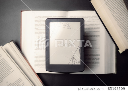 Readers. Digital e book, library reader tablet with books on dark background. Ebook, e learning electronic internet mobility concept. 85192509