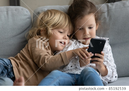 Two toddler preschooler sibling gen Z kids using online app Two toddler preschooler sibling gen Z kids using online app 85192539