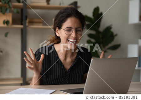 Laughing female watch funny video on laptop at social media 85193391