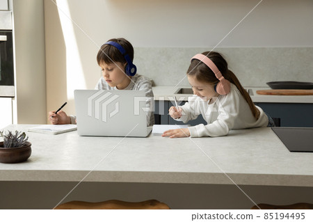 Happy little children e-learning together at home. 85194495