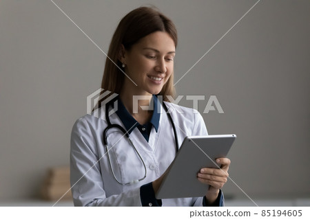Happy modern day woman medic work at web on pad 85194605