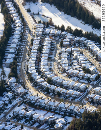 Aerial View of Residential Homes in a neighborhood of suburban modern city Aerial View of Residential Homes in a neighborhood of suburban modern city 85195429