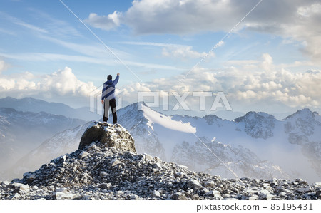 Adult Hiker Male standing on top of a rocky mountain 85195431