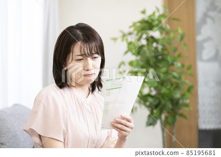 A woman who is worried about the results of a blood test 85195681