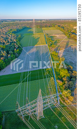 Panoramic image of high voltage road with high power poles in evening light Panoramic image of high voltage road with high power poles in evening light 85195730