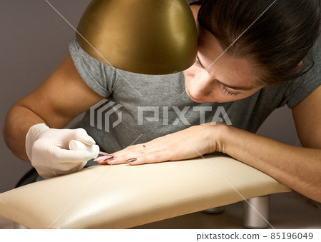 Woman doing manicure for herself. High quality photo 85196049